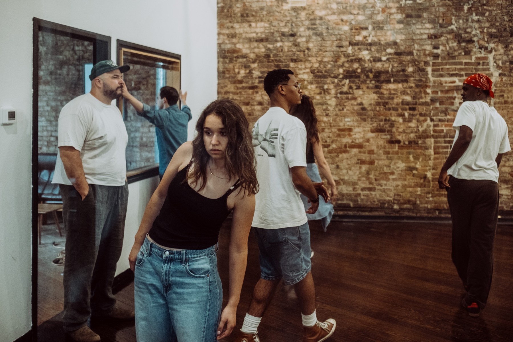 An ensemble of actors working together at Western Flower